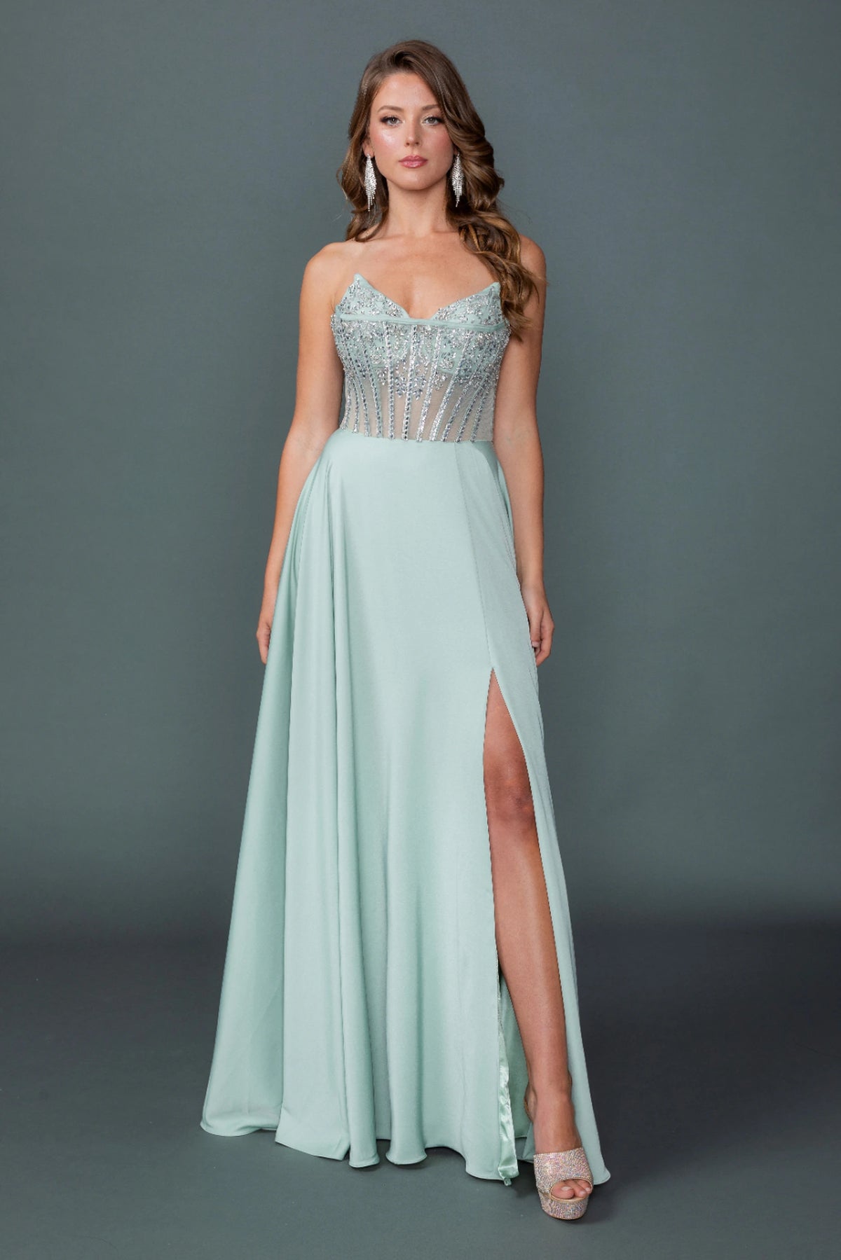 Featuring a floor-length skirt, this Sage prom dress is shown in full view.