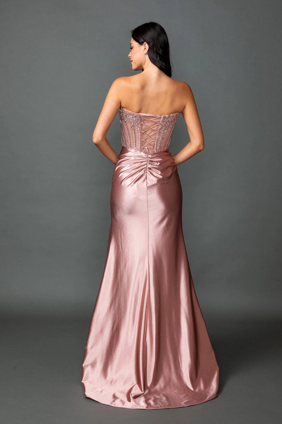 From the back, the Rose Gold prom dress reveals its floor-length skirt.