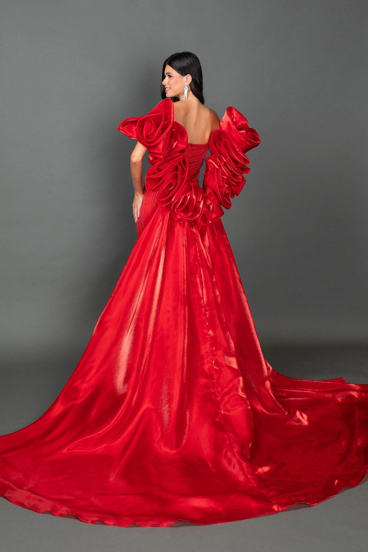 Displaying its floor-length skirt, this image offers another view of the Red prom dress.