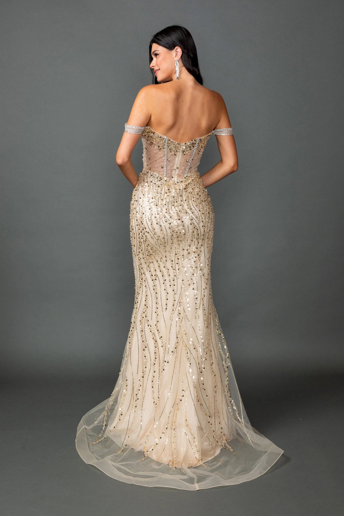 From the back, the Champagne prom dress reveals its floor-length skirt.