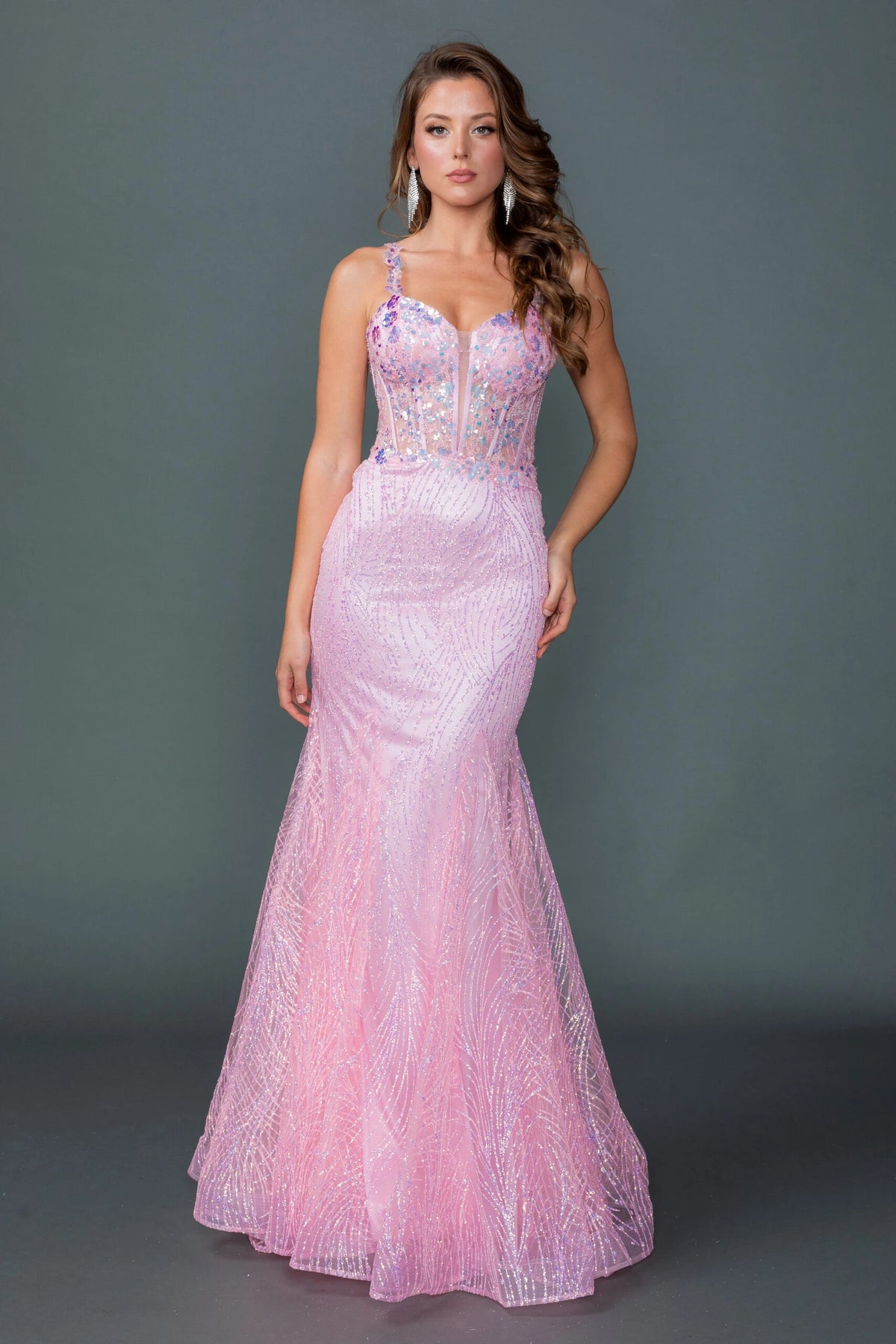 Featuring a floor-length skirt, this Pink prom dress is shown in full view.
