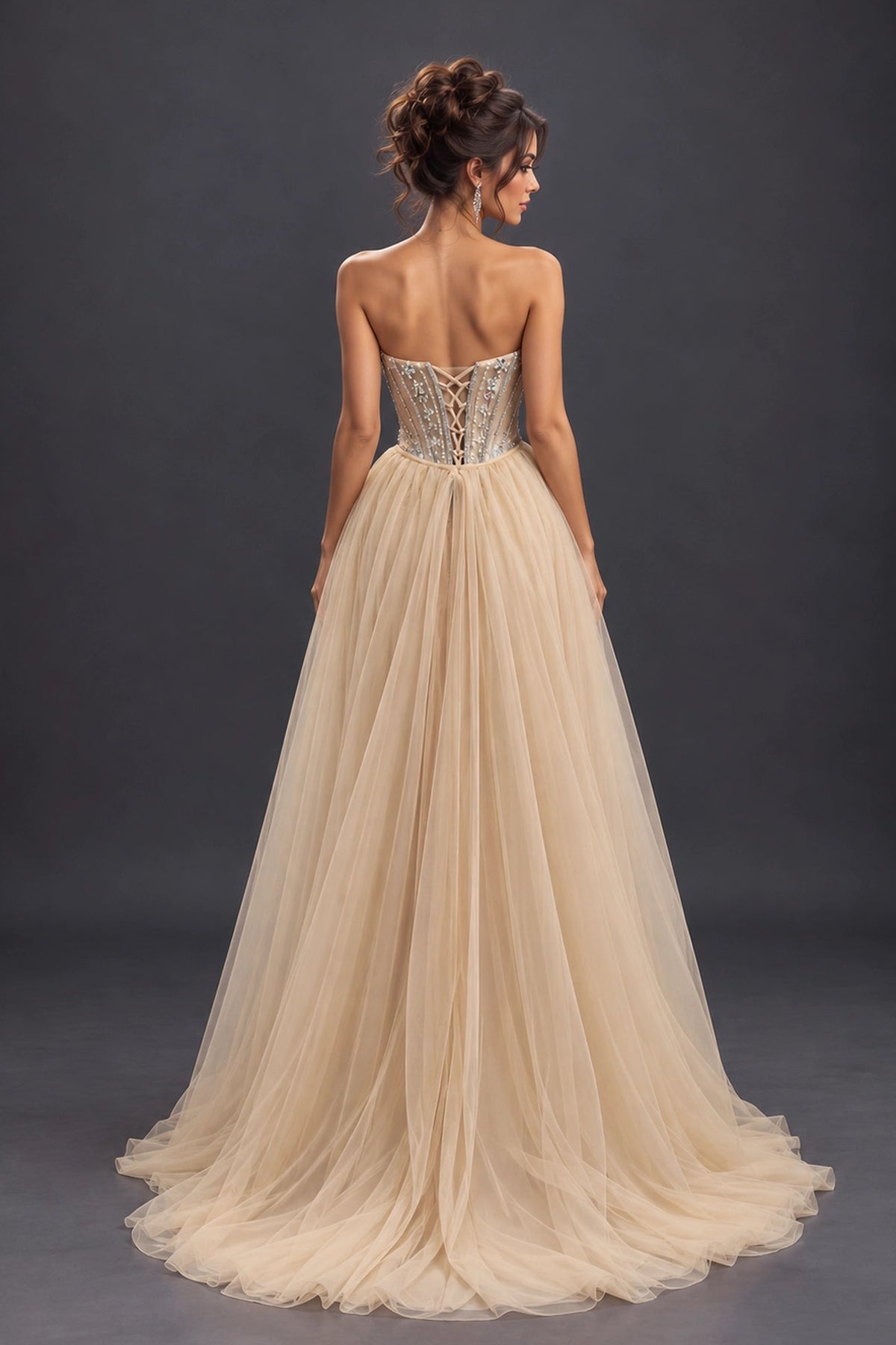 From the back, the Champagne prom dress reveals its floor-length skirt.