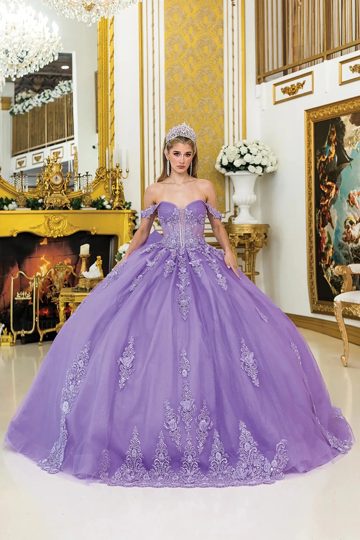 Bodice close-up highlights lilac quinceañera ball gown with off-shoulder floral appliqué sleeves, sheer corset bodice.
