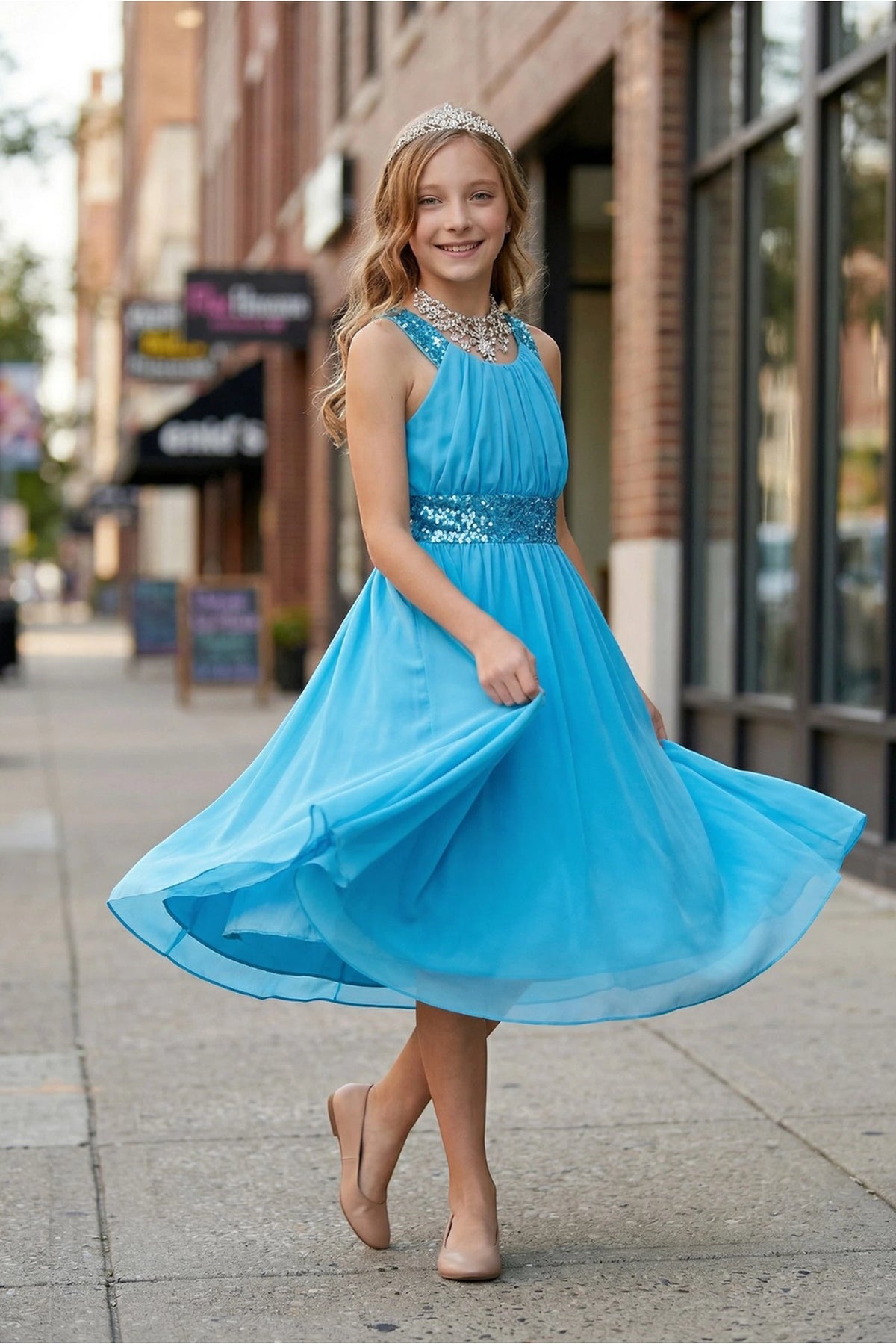 Jade kids party dress with a sequin waistband and gathered chiffon skirt.