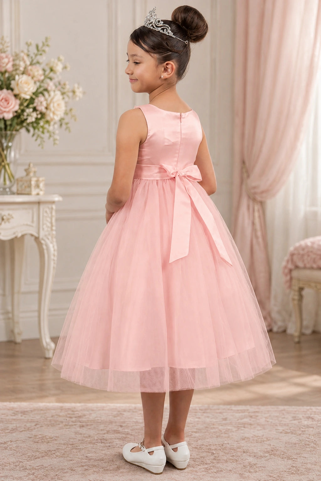 A wide satin bow ties across the back of this Blush flower girl dress.