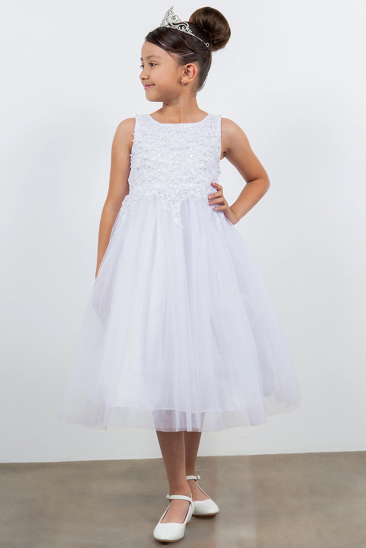 Layered tulle flows from the waist of this White flower girl dress.