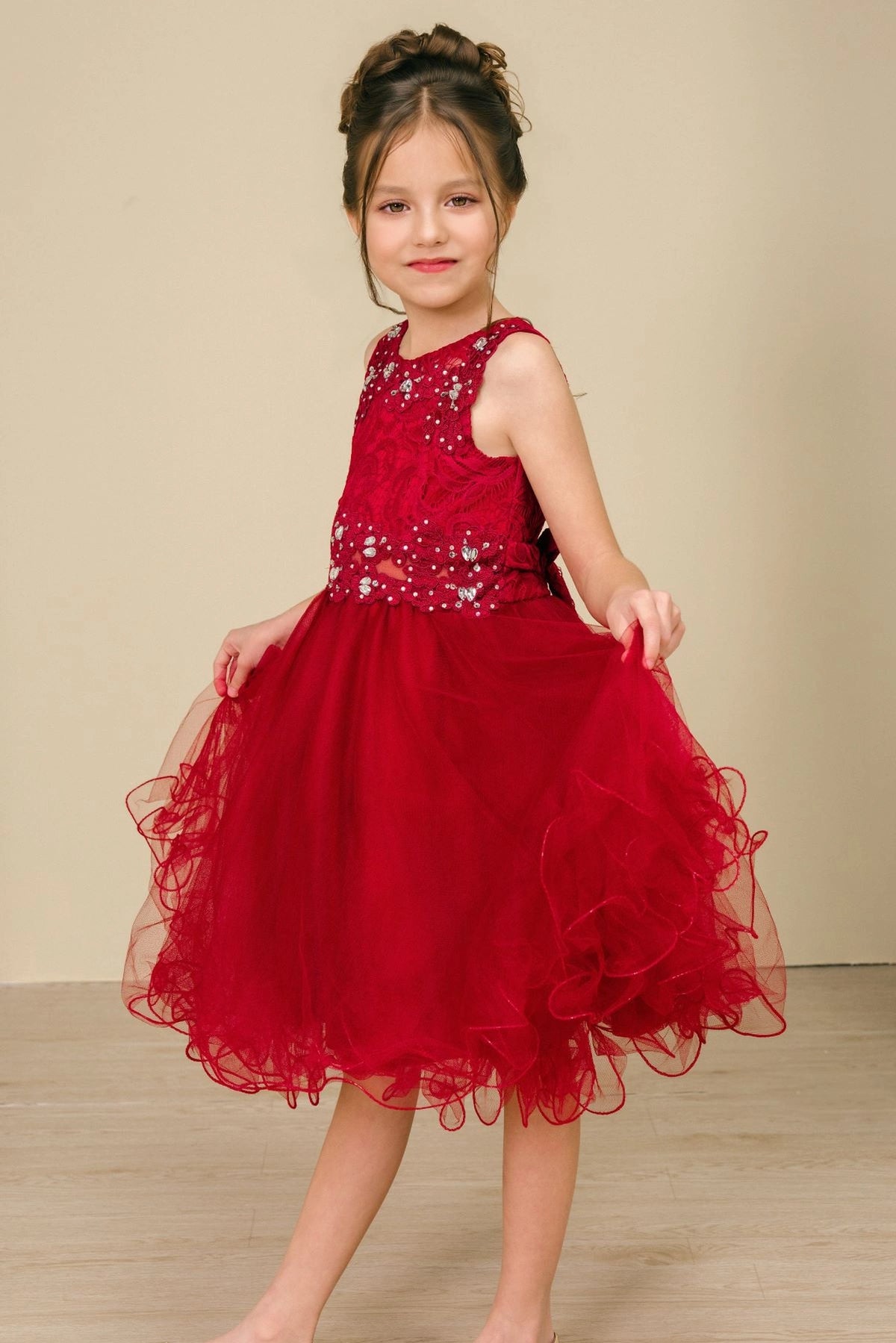 Accented beaded floral lace on the bodice adds character to this Burgundy kids party dress.