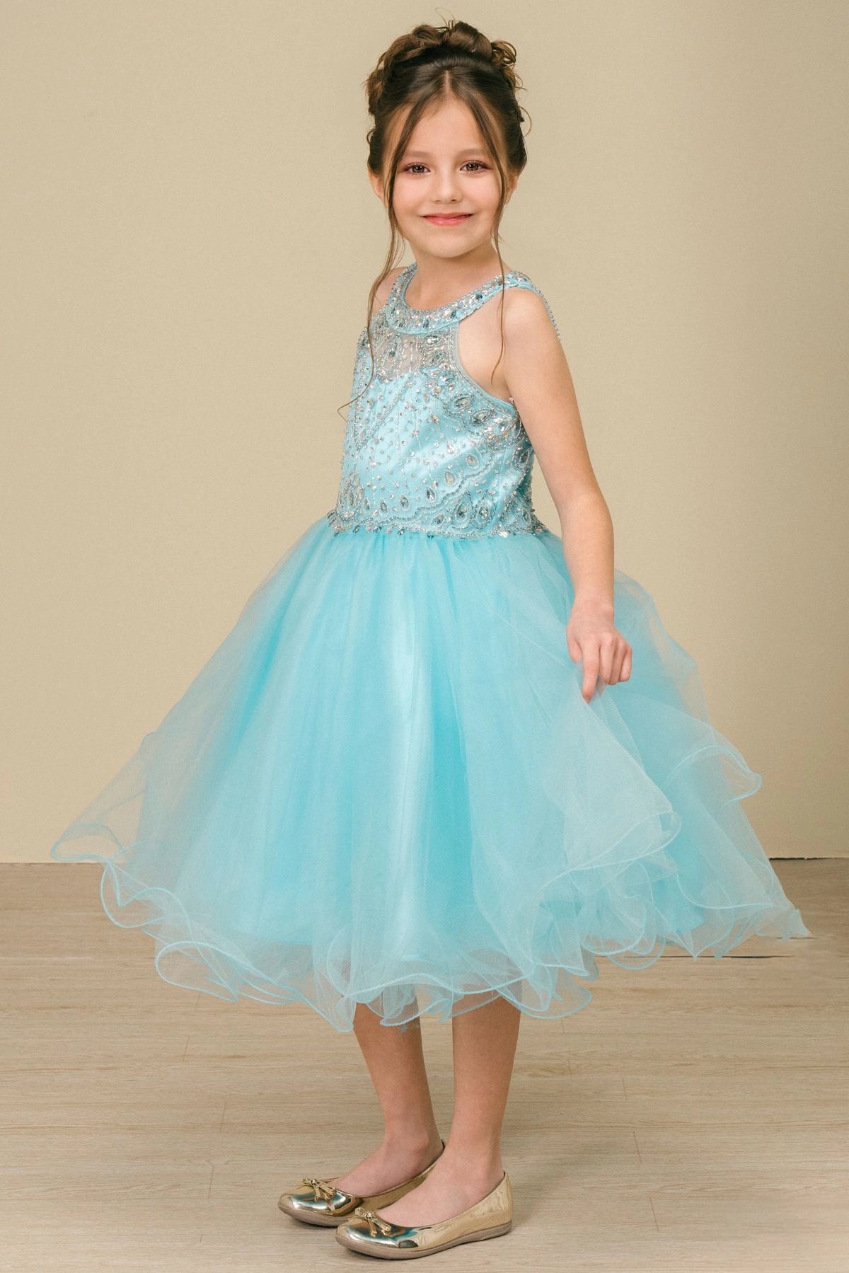 Accented a full tulle skirt adds character to this Aqua kids party dress.