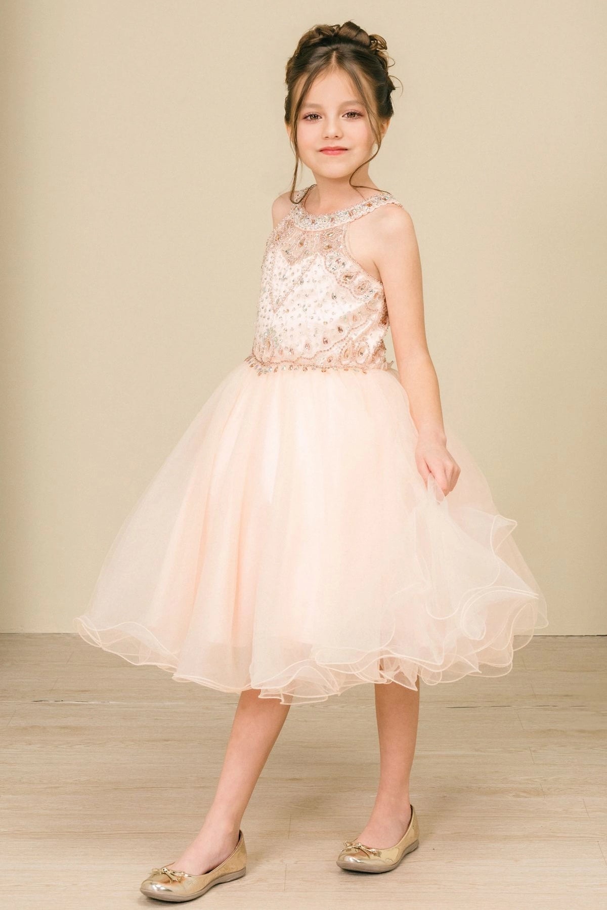 Accented a full tulle skirt adds character to this Blush kids party dress.