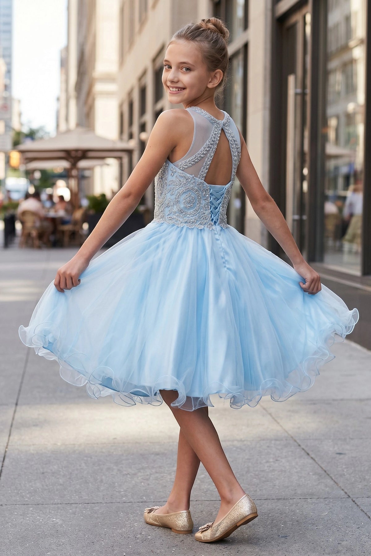 Finished details of a layered tulle skirt distinguish the Skyblue kids party dress.