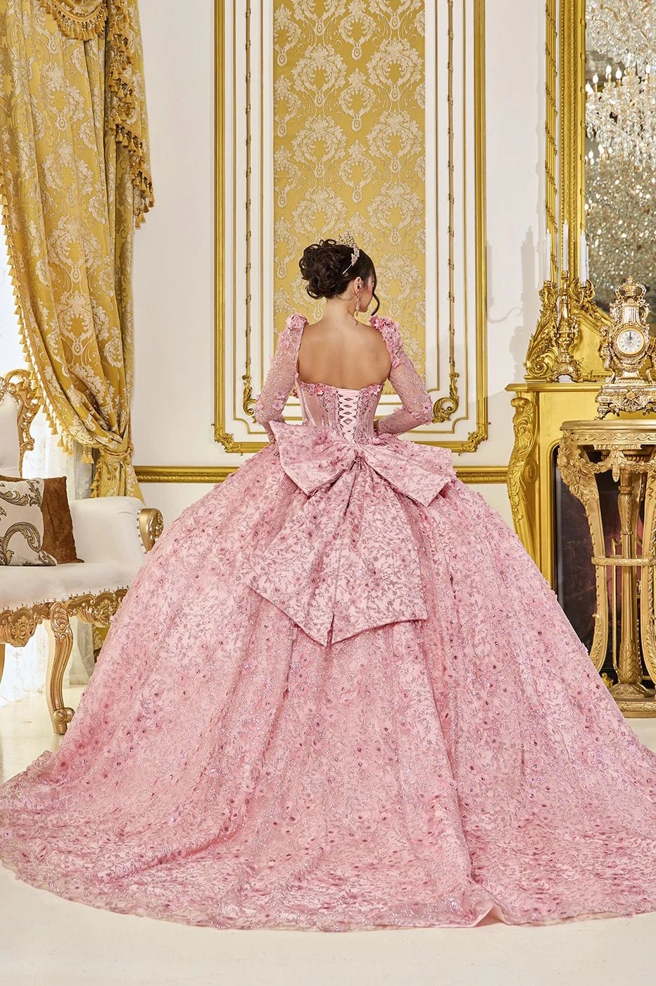 blush quinceanera dress with lace-up corset back, extra big bow, embroidered floral appliques, and chapel-length train