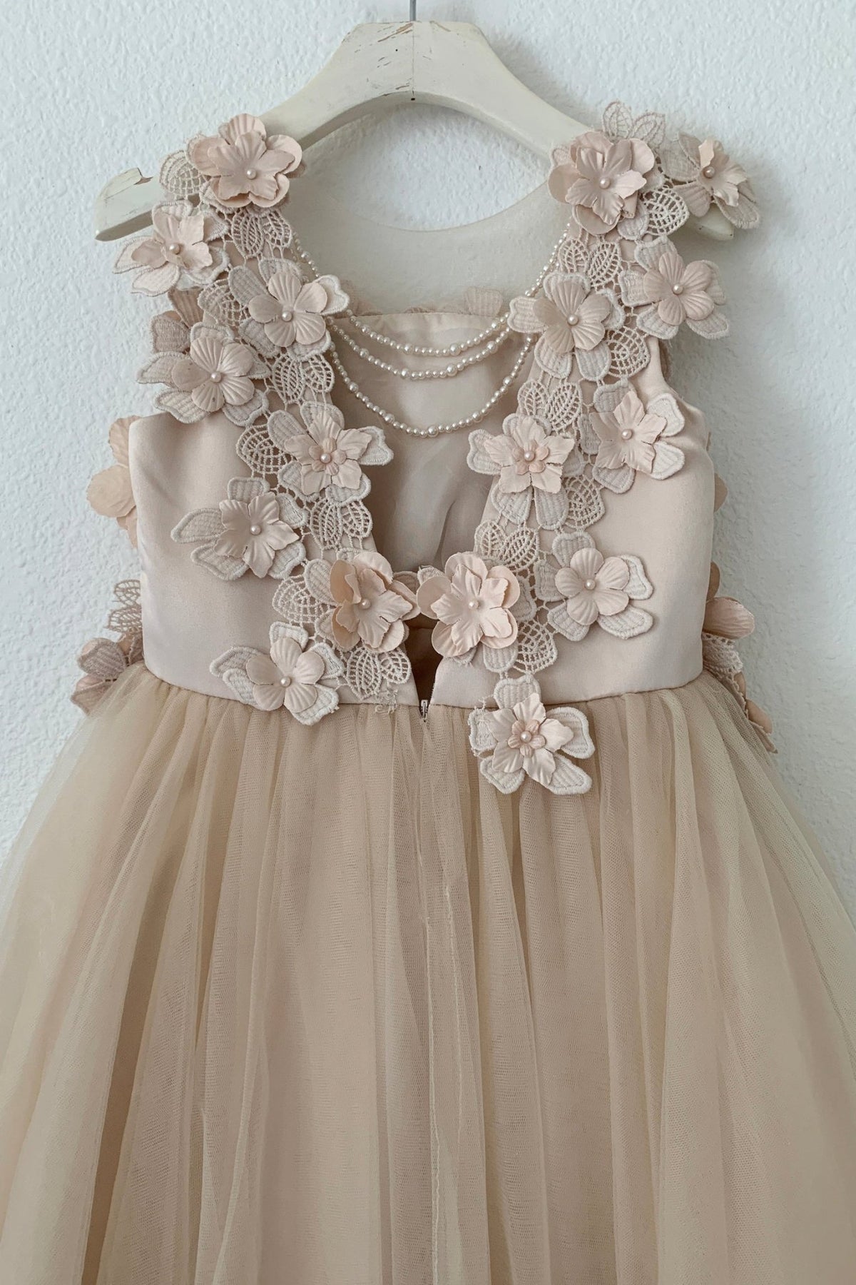 Detailed view highlights Champagne High-Low flower girl dress with floral lace top.