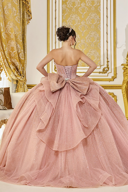 Back view of a Rose Gold quinceañera gown showing lace-up back and oversized bow