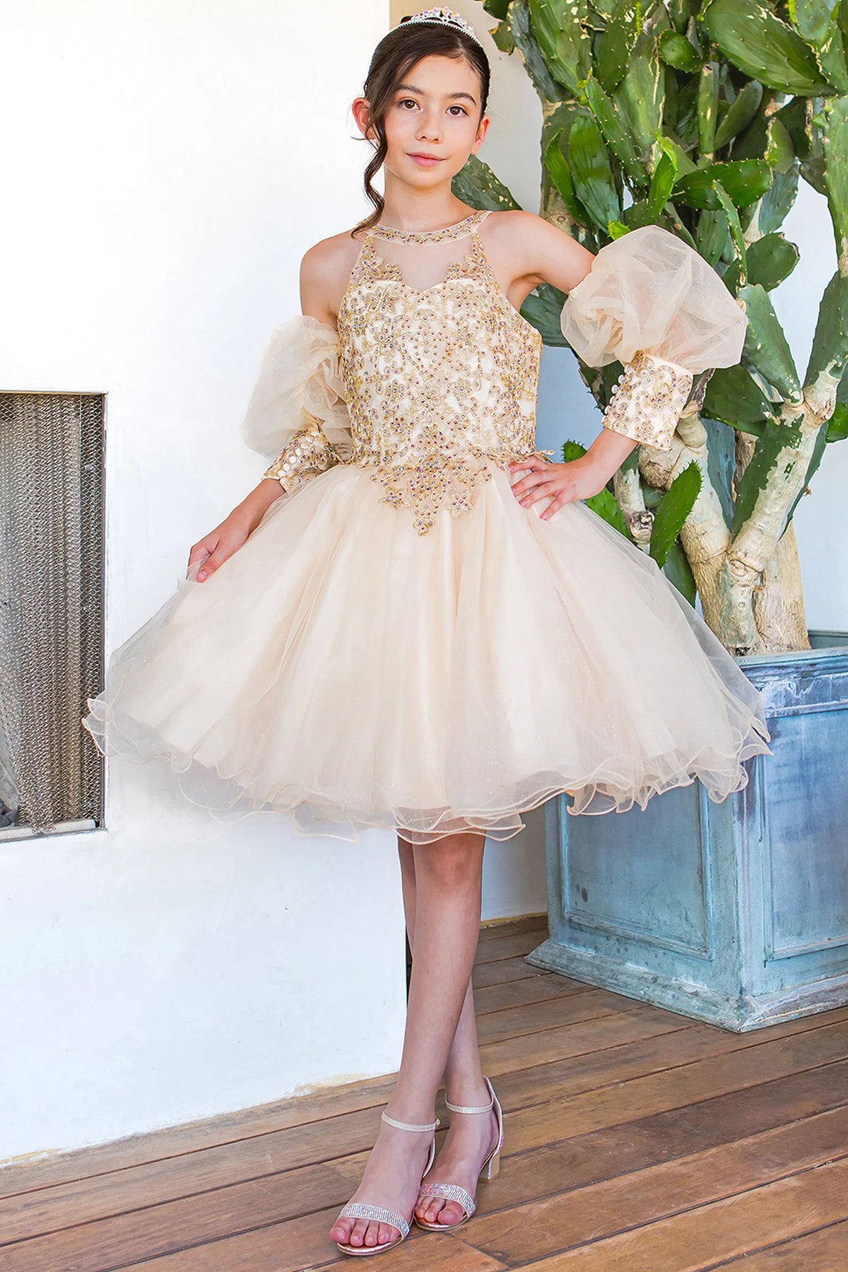 Highlighted puffed off-shoulder sleeves adds character to this Champagne kids party dress.