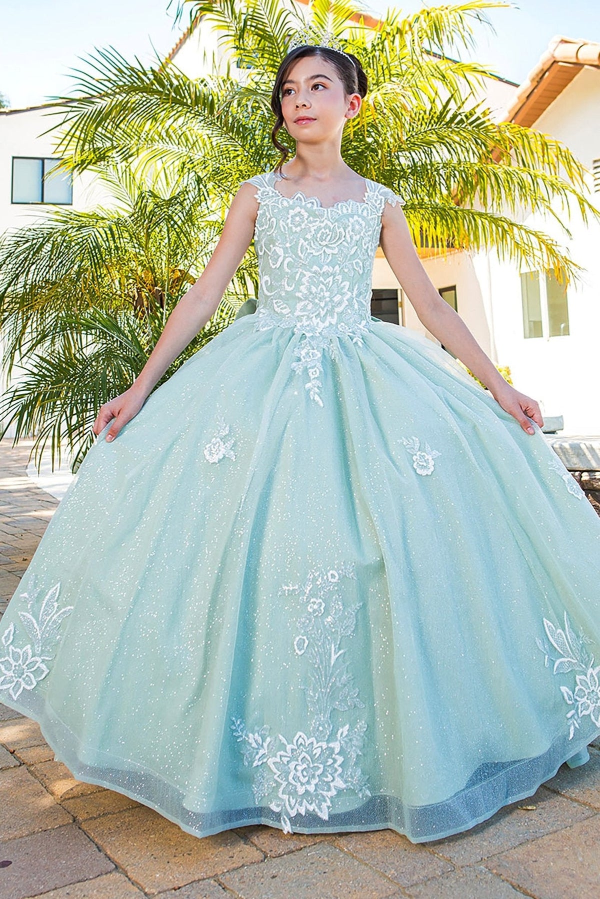 Back detail shows sage mini quince dress with 3D sparkling fabric 3D flower puff print detachable ribbon.