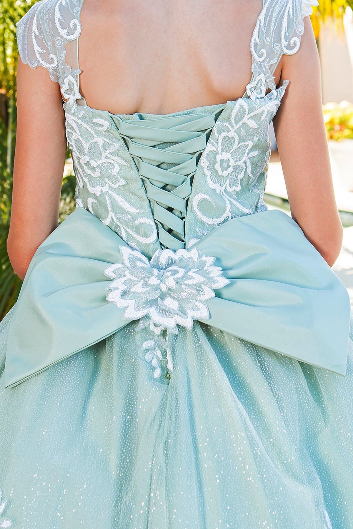 Front view of blue mini quince dress with glitter tulle sequin lace applique lace-up bodice.