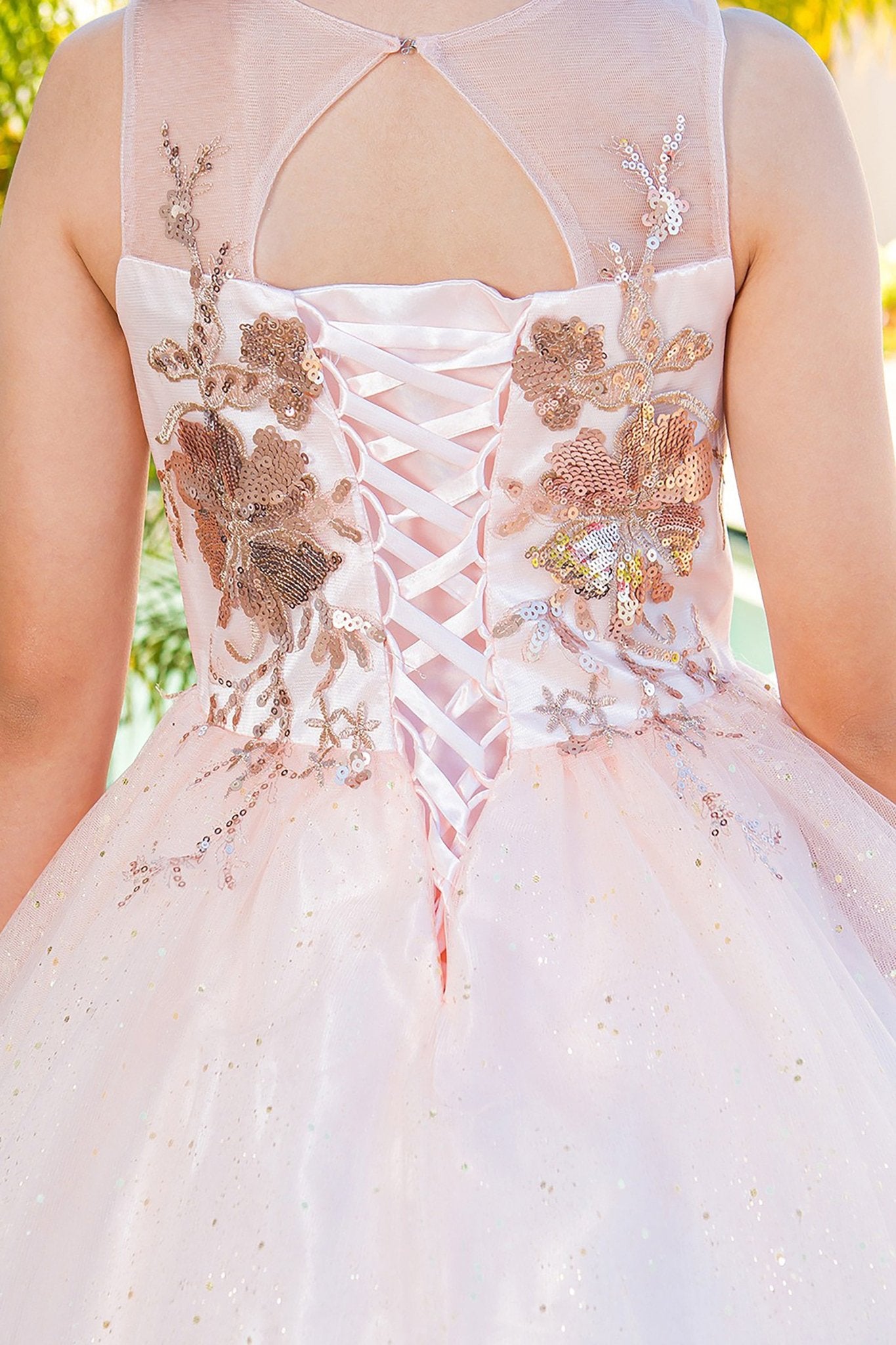 Blush mini quince dress with glitter tulle layered skirt and back detail.