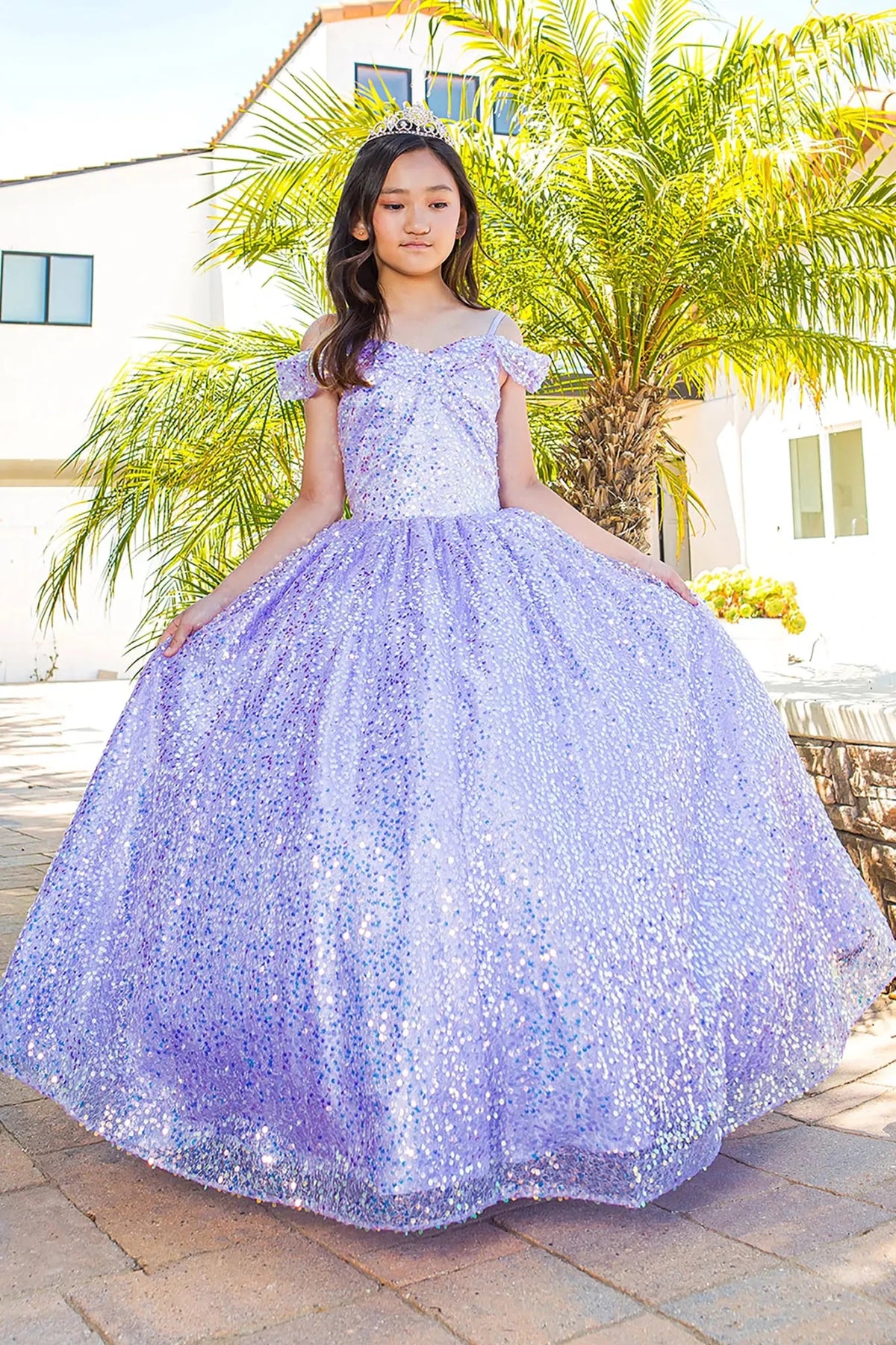 Side profile shows lilac mini quince dress with glitter tulle sequin lace applique.