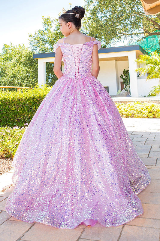 Back view of a kid wearing pink mini quince dress with glitter tulle 3D flower puff print and A-line skirt
