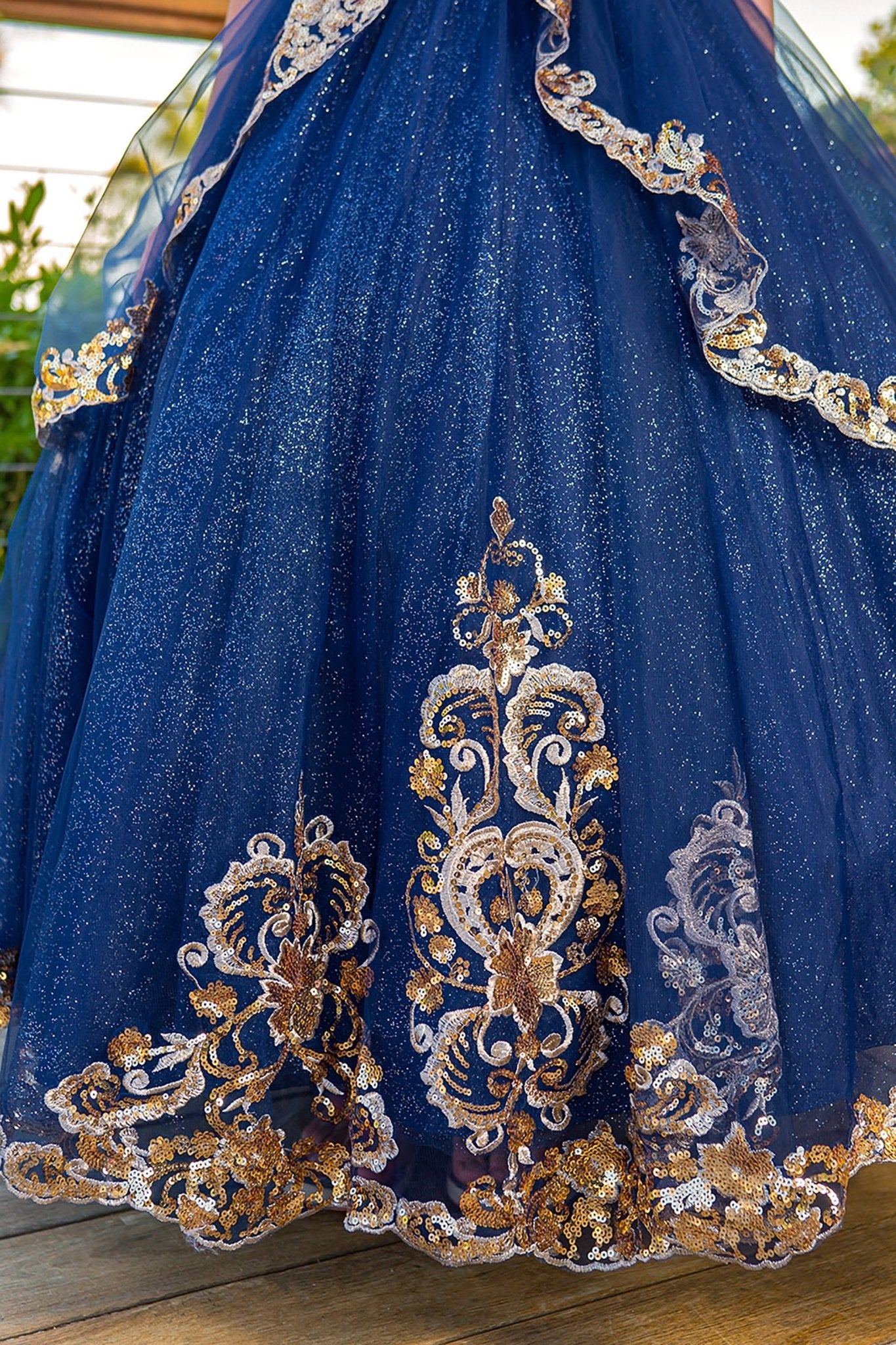 Close-up of navy mini quince dress with glittered two-tone lace satin tulle skirt detailing
