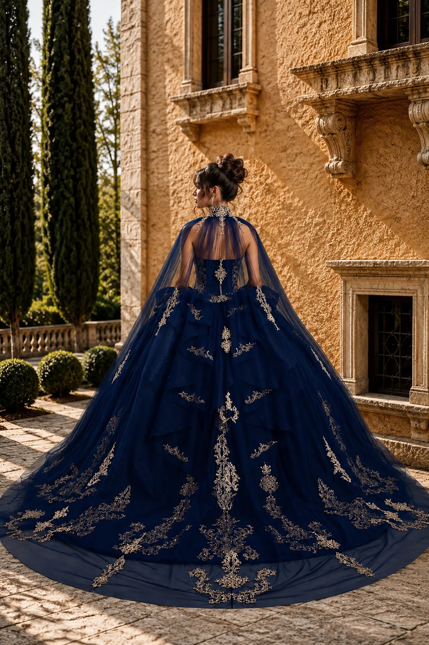 navy quinceanera ball gown with lace-up corset back, detachable cape, gold embroidery, and chapel-length train