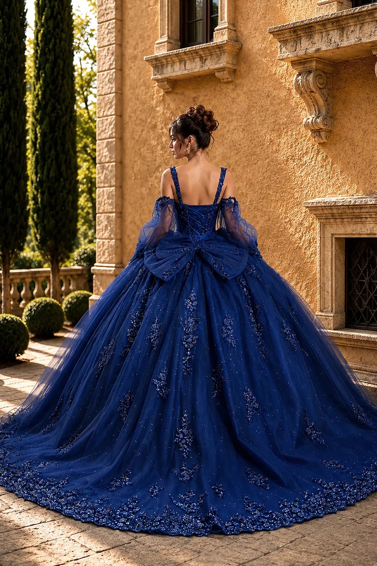 navy quinceanera ball gown with lace-up corset back, detachable puff sleeves, glitter tulle skirt, and back bow