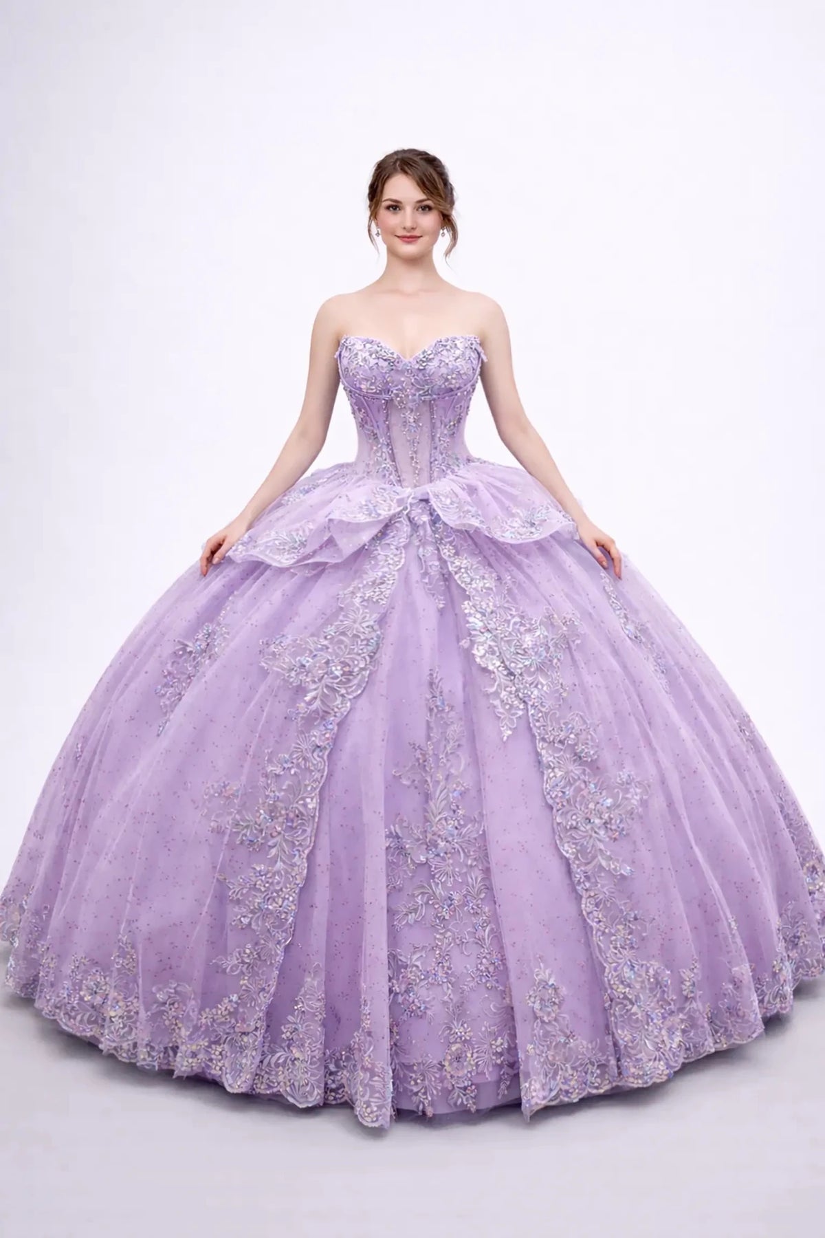 Front view of a woman wearing lilac quinceañera dress, strapless corset, embroidered appliques, layered tulle overskirt