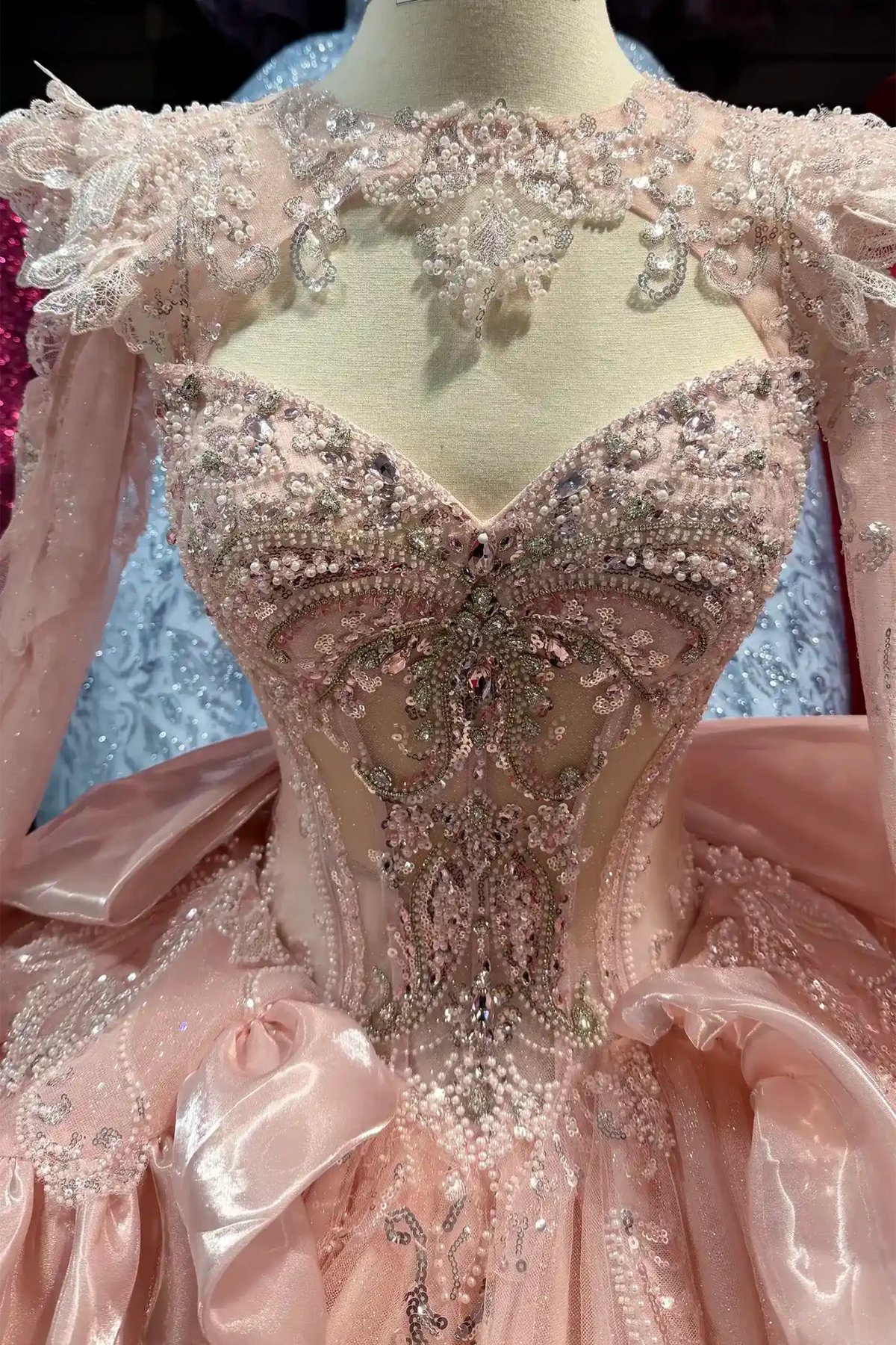 blush quinceanera ball gown with sweetheart neckline, beaded embroidered bodice and glitter tulle fabric