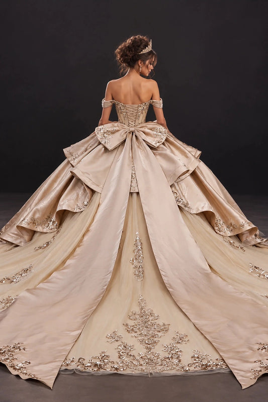 From the back, the Gold quinceañera ball gown reveals its floor-length skirt.