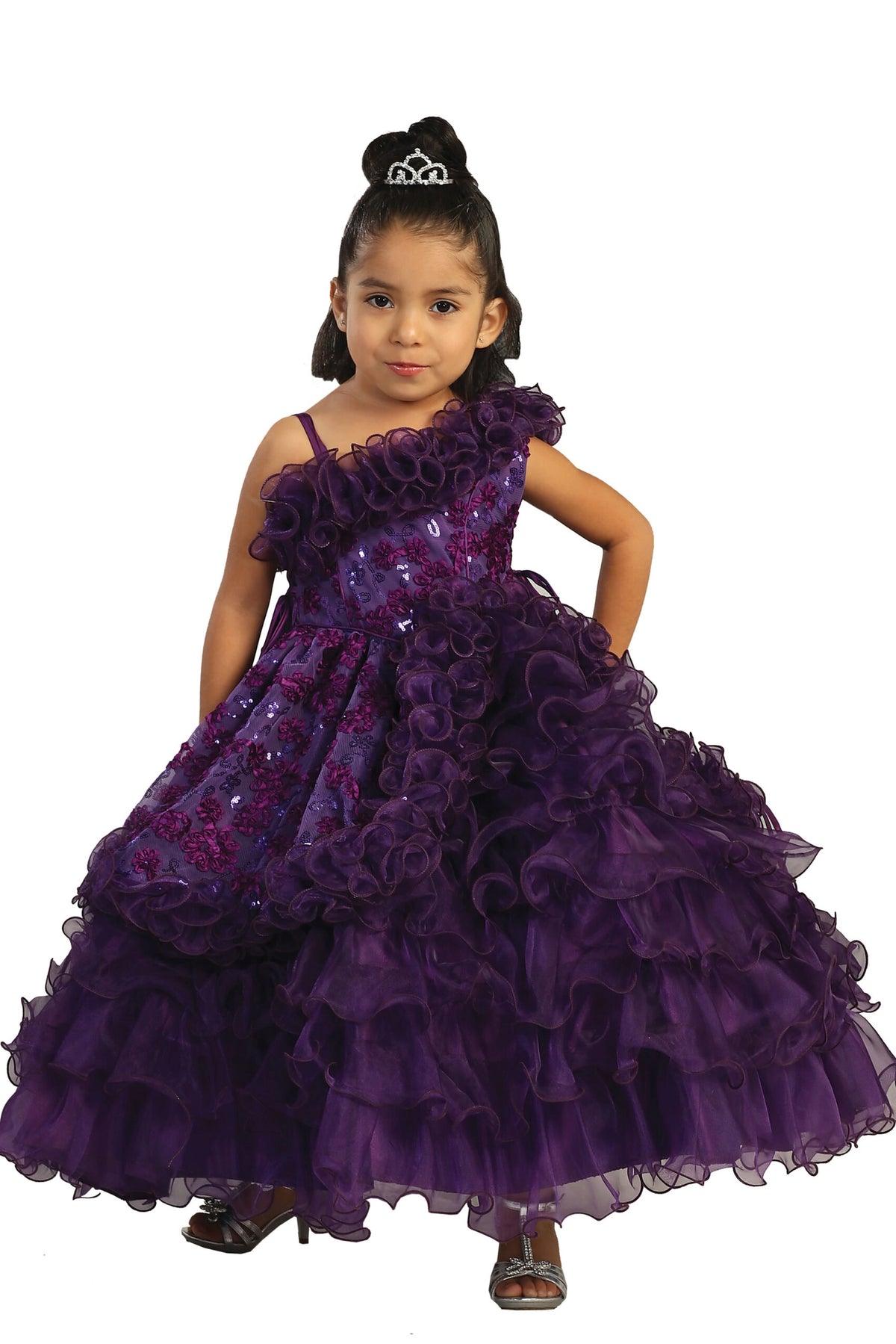 Purple kids pageant dress featuring an asymmetric ruffled neckline.