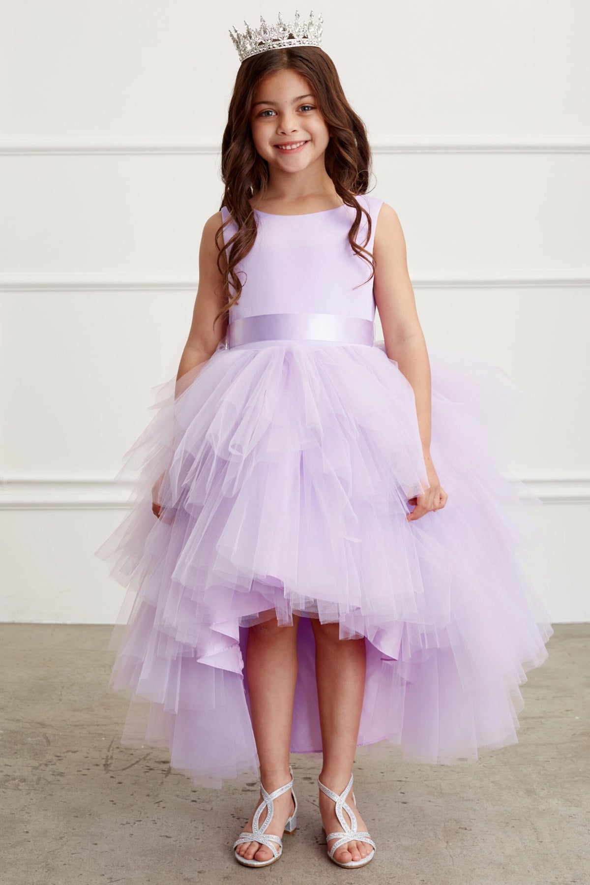 Lilac kids pageant dress featuring a satin bodice and layered high-low tulle.