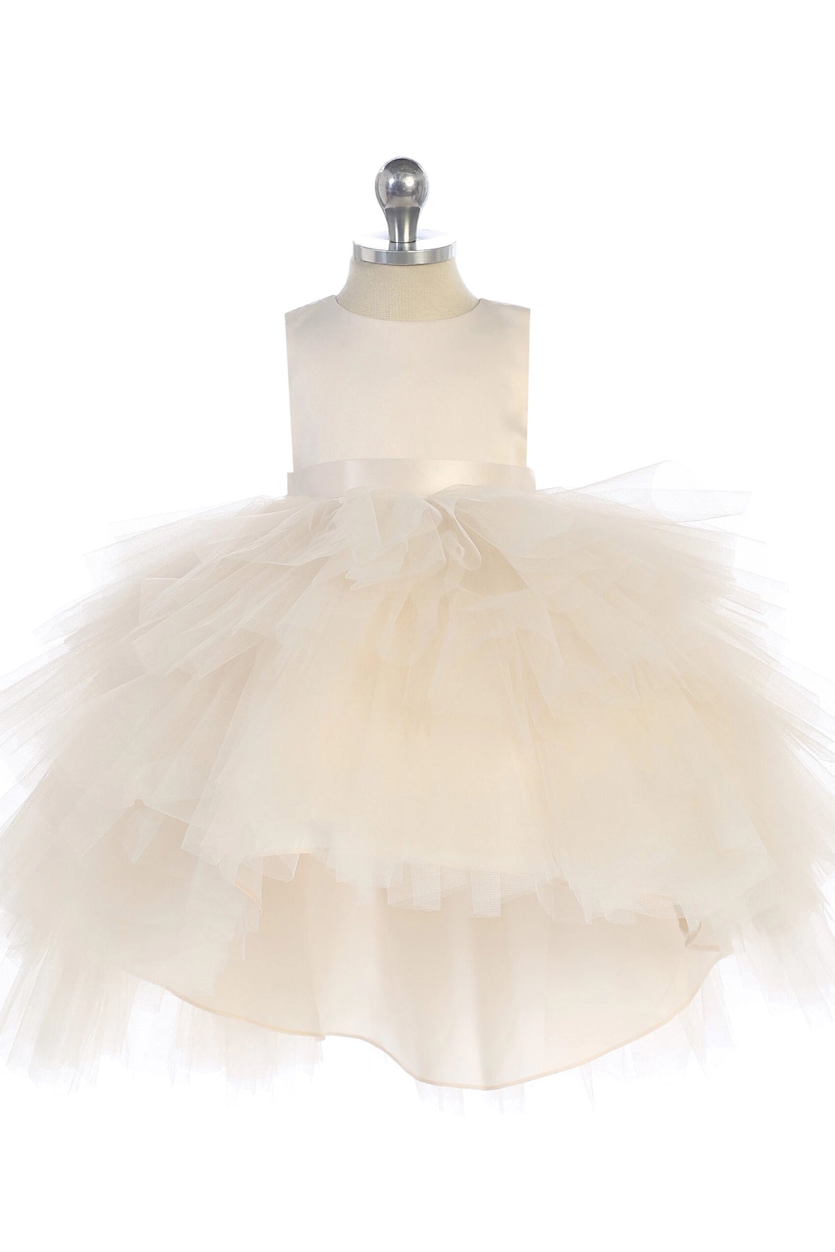 On the Ivory kids pageant dress, the detailing includes a satin bodice and layered high-low tulle.