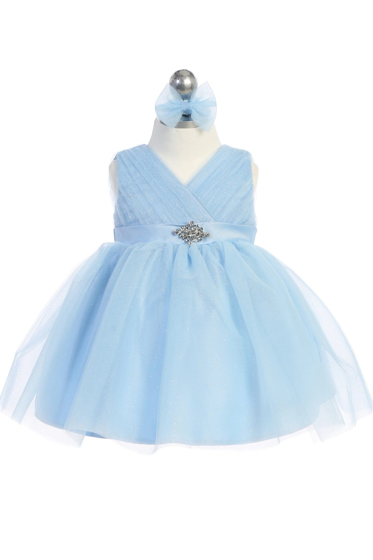 Seen from the front, this Sky Blue kids pageant dress displays a ruched V-neckline and rhinestone brooch.
