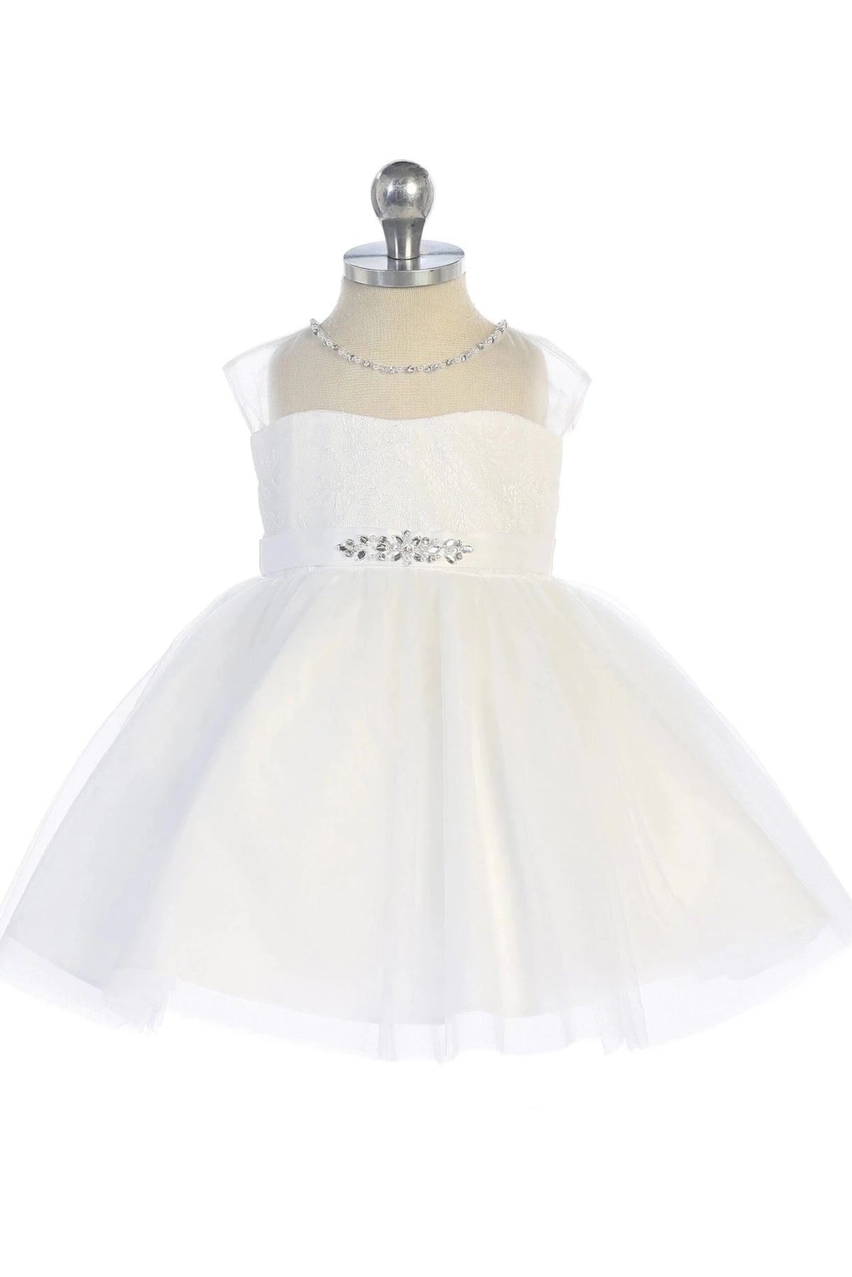 Jewels glint at the waist of an off-white flower girl dress.