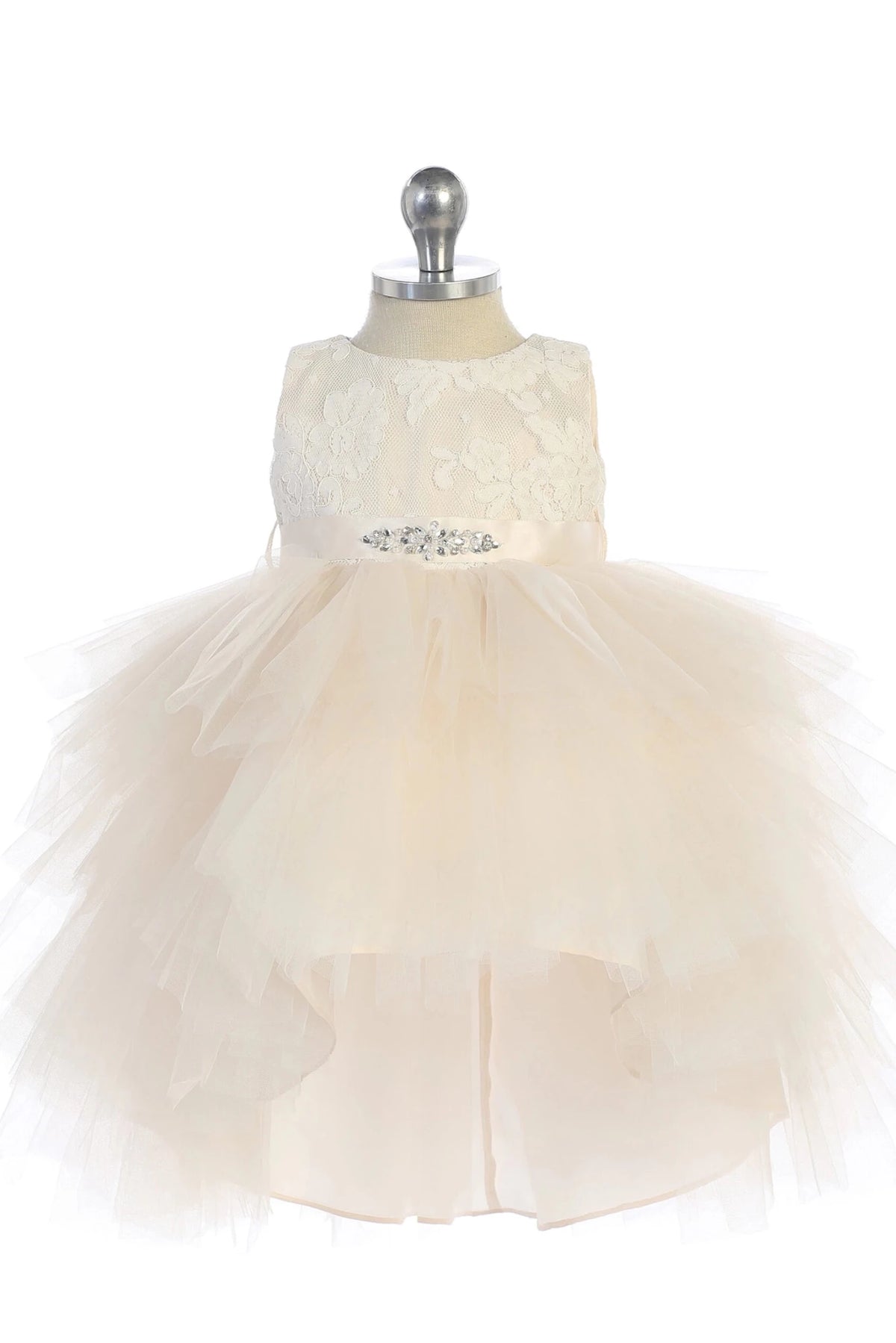 Layered high-low hem accents the champagne flower girl dress.