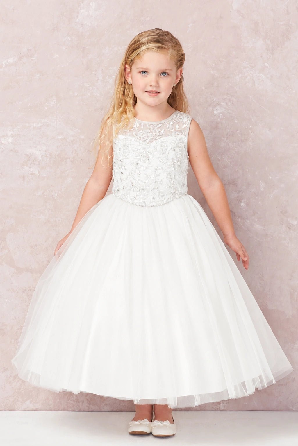 Off-White flower girl dress with a swirling lace overlay.