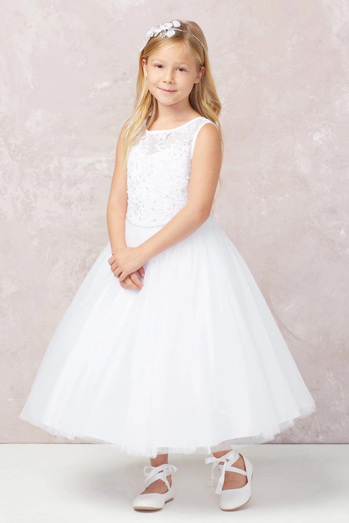 Small embroidered flowers shown on the white flower girl dress.