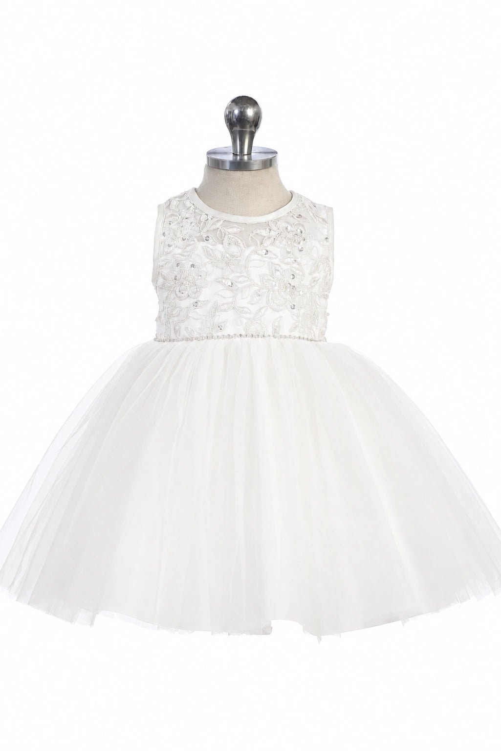 Featuring a gathered tulle skirt, a white flower girl dress.