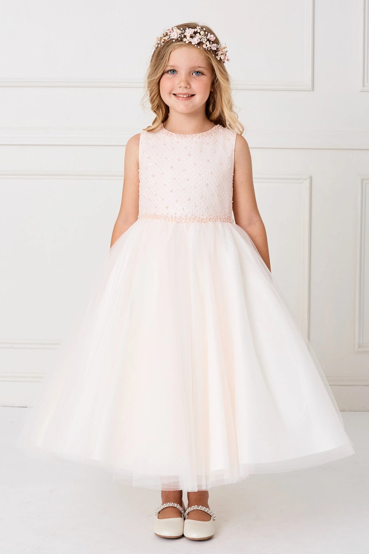 Soft gathered skirt is visible on the blush flower girl dress.