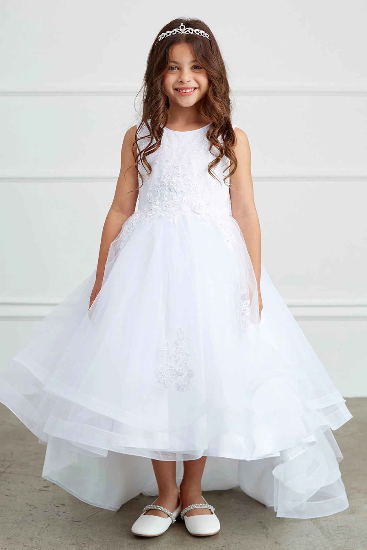 White flower girl dress detailed with a floral bodice.