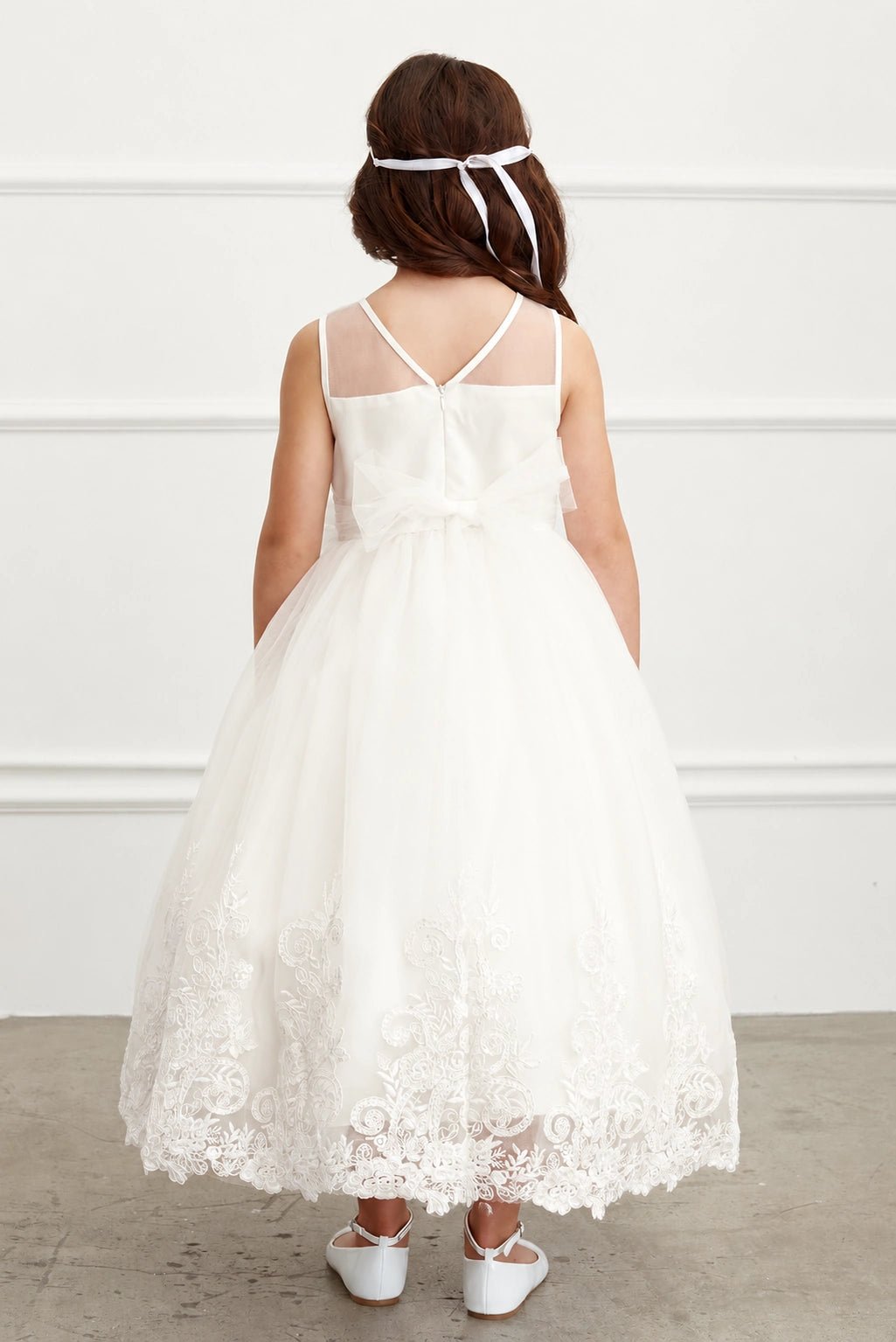 Off-White flower girl dress detailed with sheer V back.