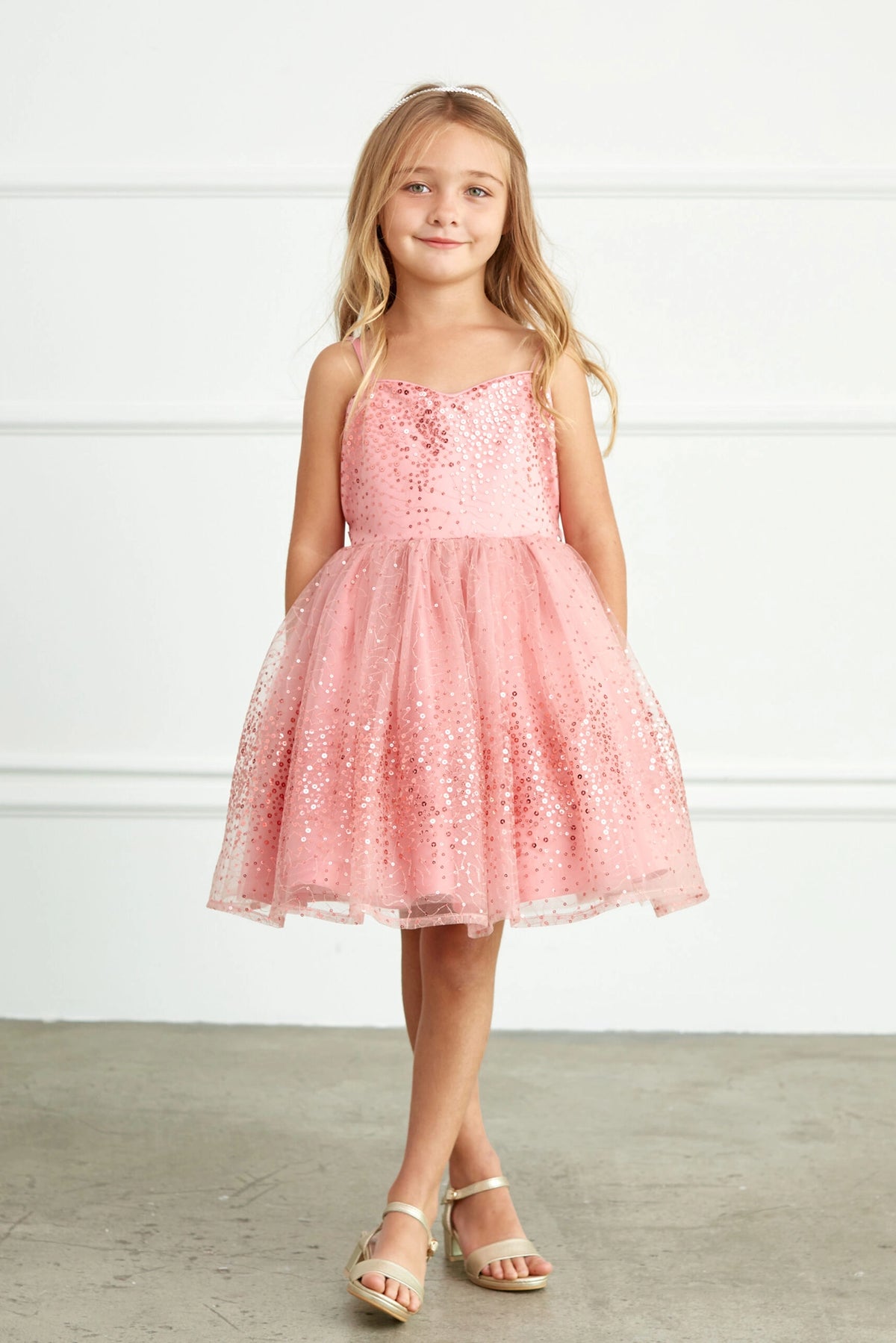 Mauve kids pageant dress featuring sequins across the bodice and skirt.