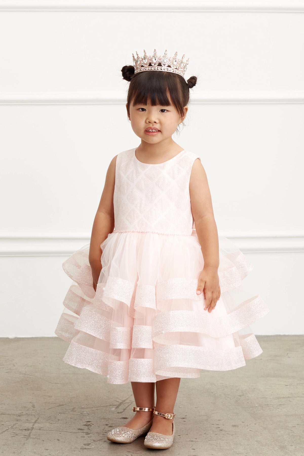 Blush kids pageant dress featuring a short tiered mesh skirt.