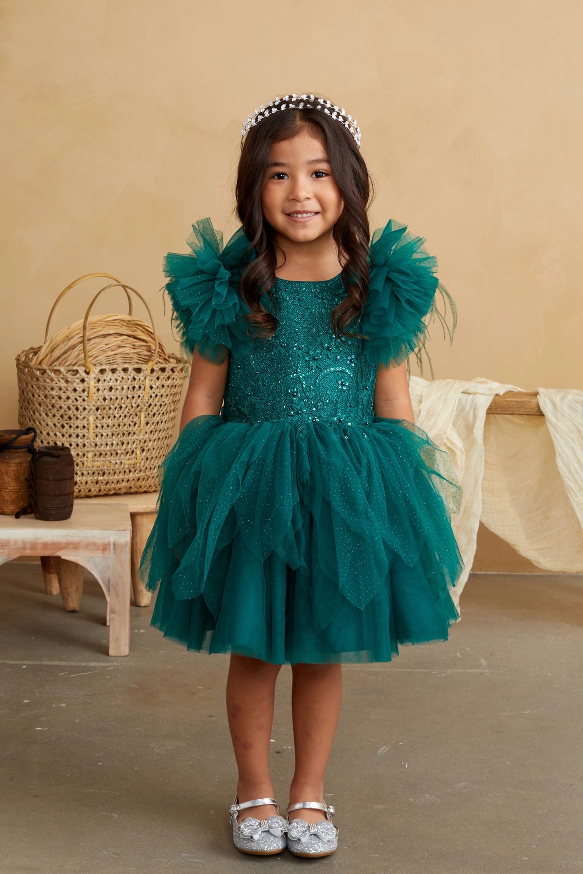 Emerald kids pageant dress featuring feather-trimmed flutter sleeves.