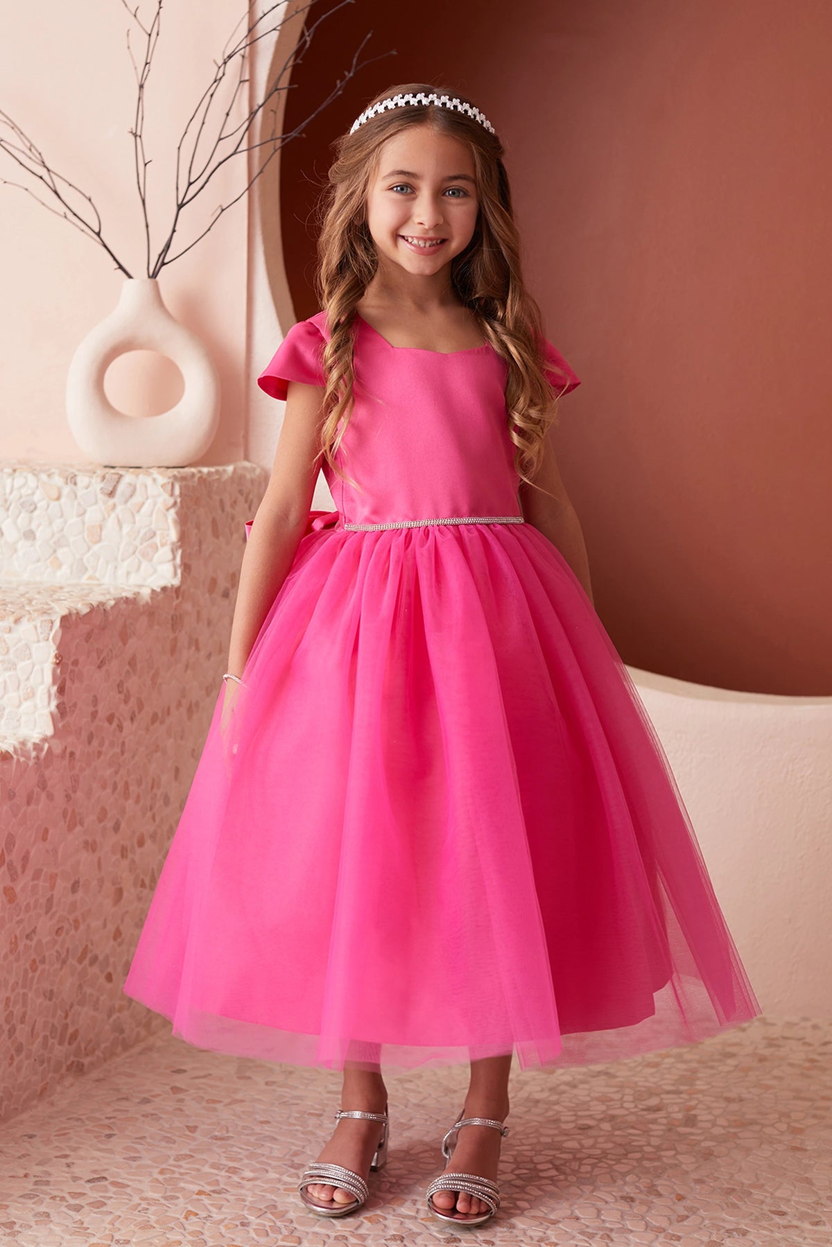 Fuchsia kids pageant dress featuring a square satin neckline and tulle skirt.