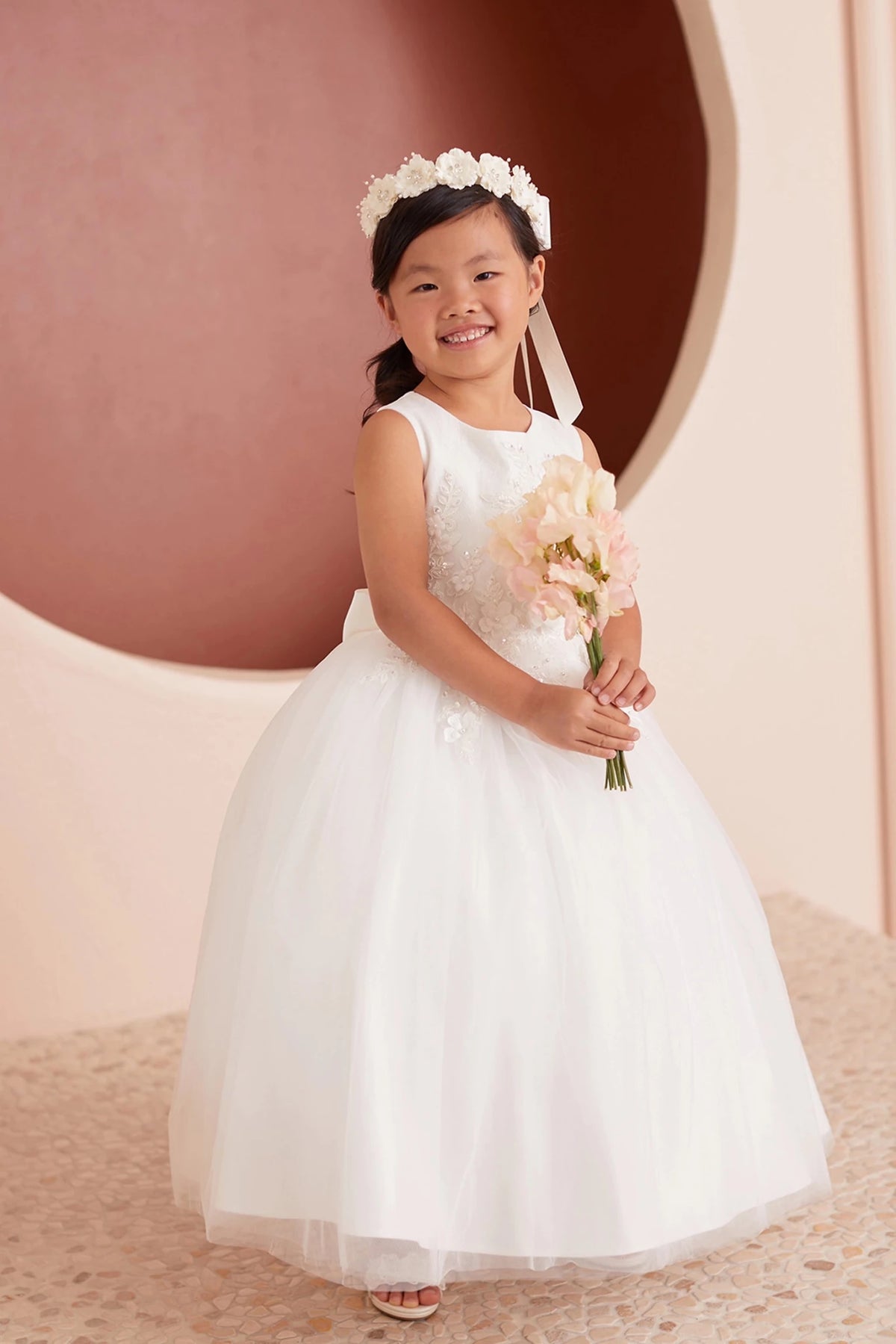 Front view of the ivory 3d floral lace with a bow back flower girl dress.