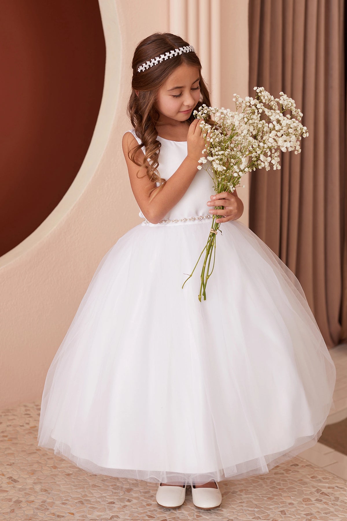 Full gathered skirt shown on the white flower girl dress.