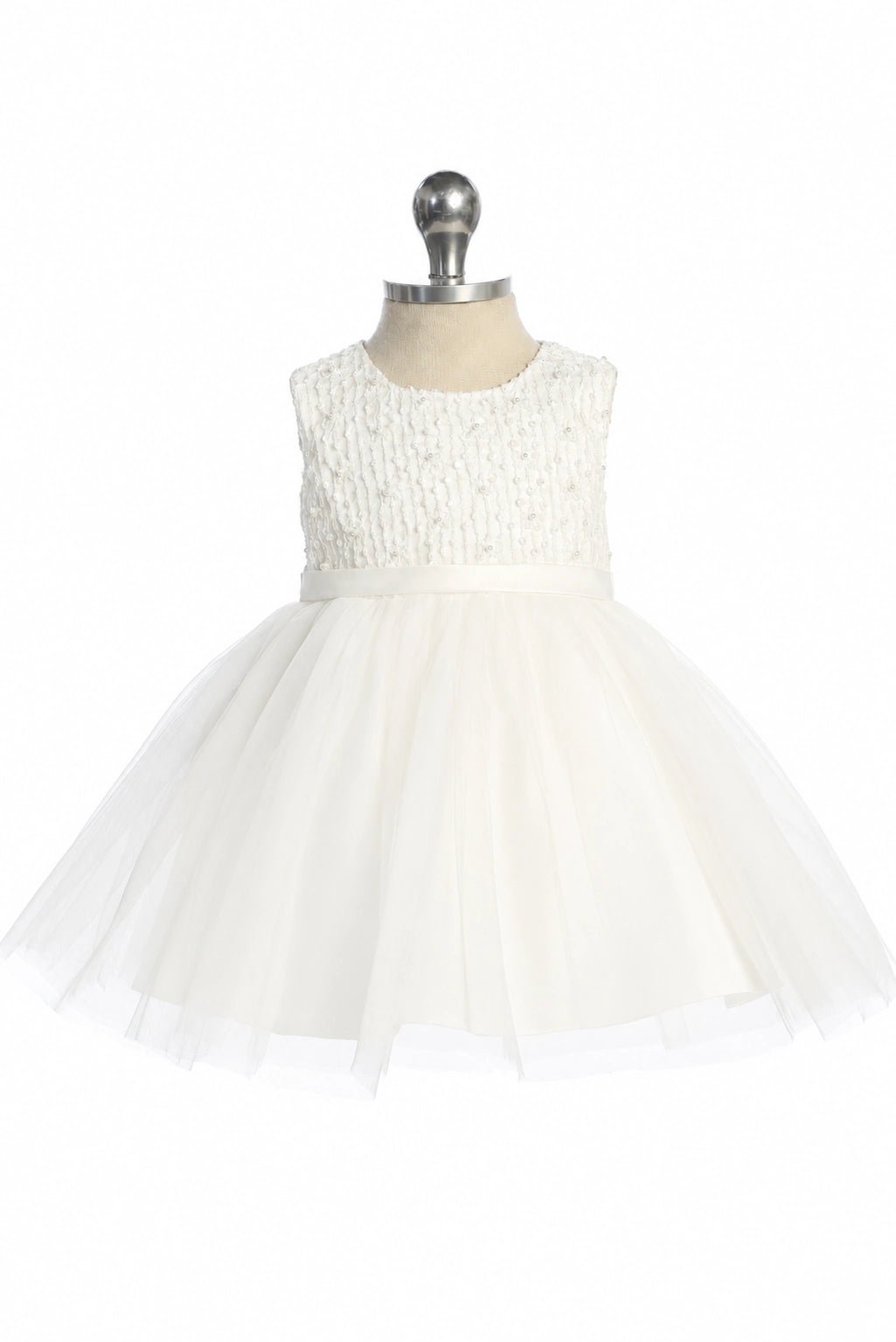This off-white flower girl dress displays a full mesh skirt.