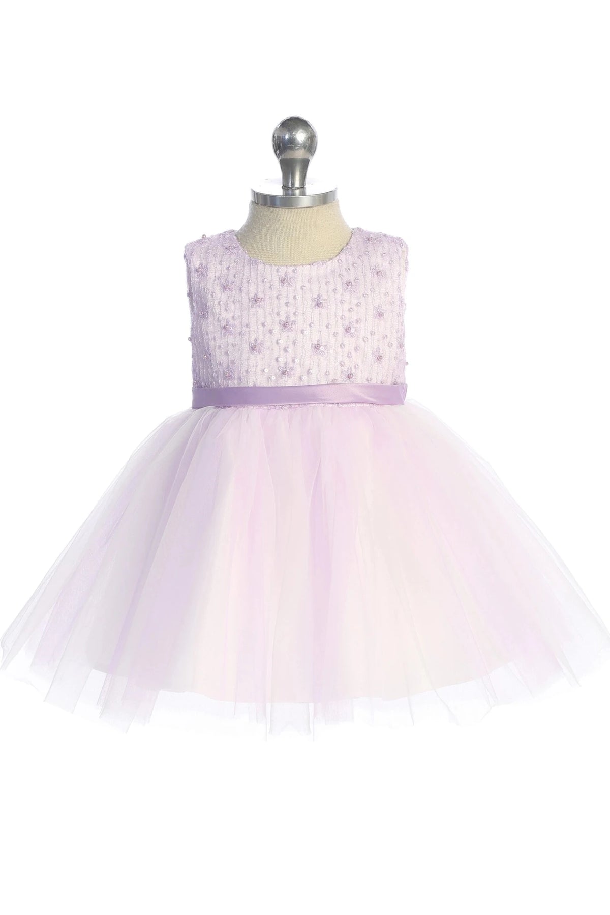Defined by a gathered tulle skirt, this lilac flower girl dress.