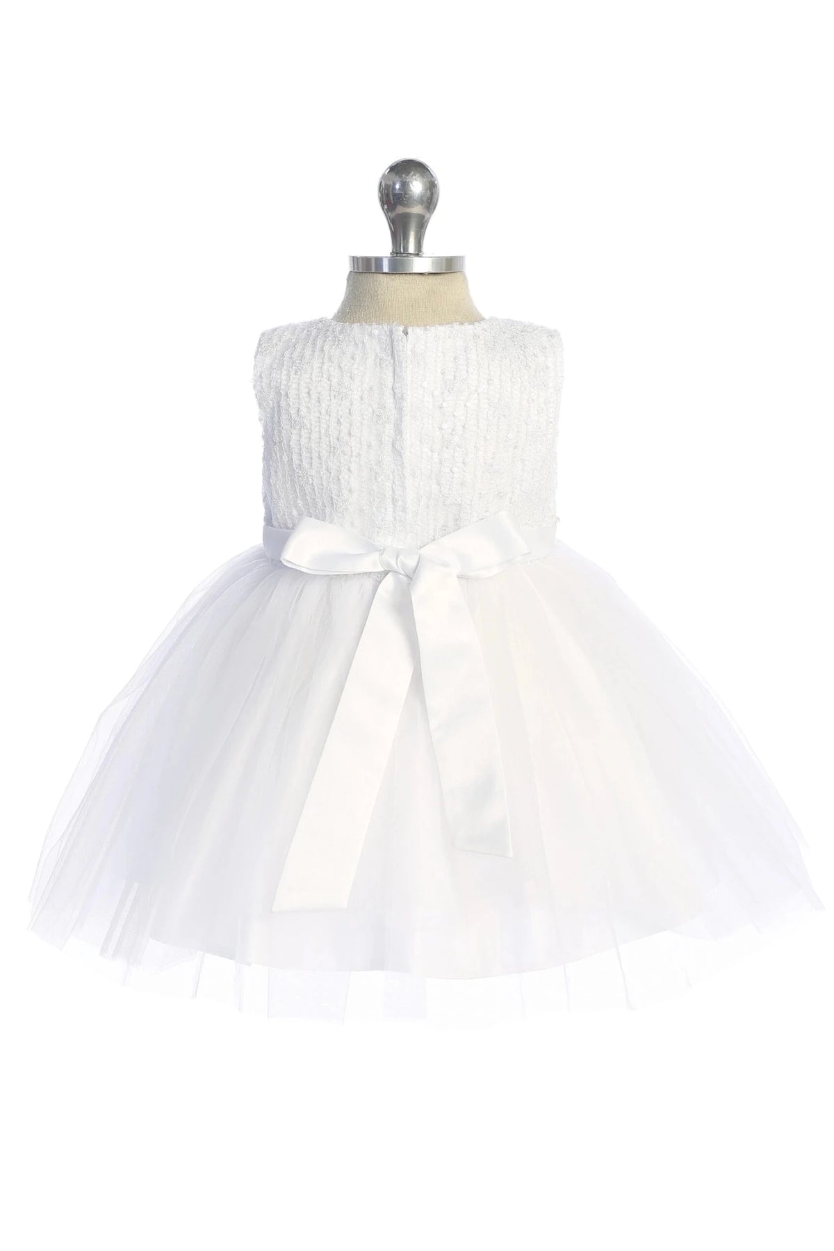 Satin back bow on a white flower girl dress.